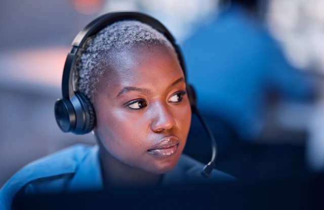 Person in an office with headphones